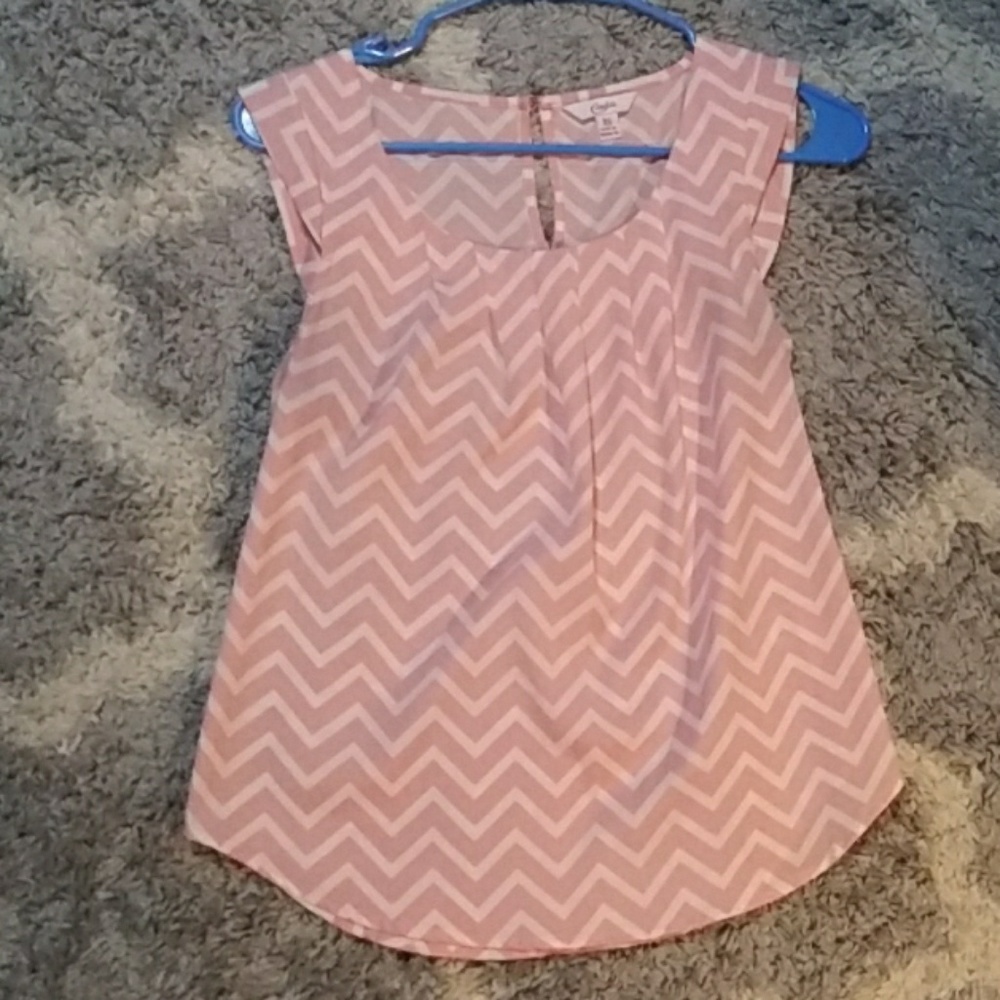 Sleeveless pink and white shirt